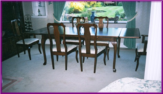 Mahogany dining suite with boxwood and flower inlays 