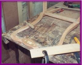 Fitting boxwood inlays into Mahogany chairs in workshop