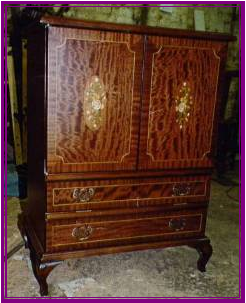 A Mahogany tv Cabinet with inlays and boxwood detailing