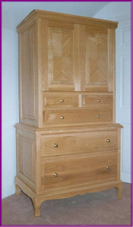 Solid natural Oak tallboy with quarter veneered doors part of suite