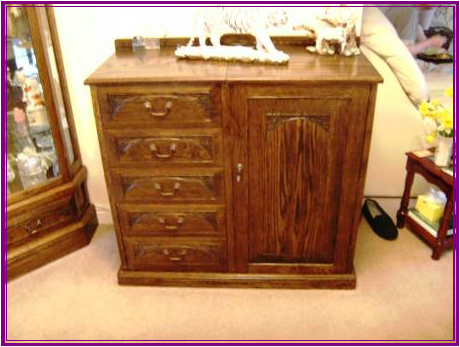 A hand made cabinet in oak I  made to contain music related Items 